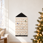 Nordic wall calendar beside a softly blurred Christmas tree