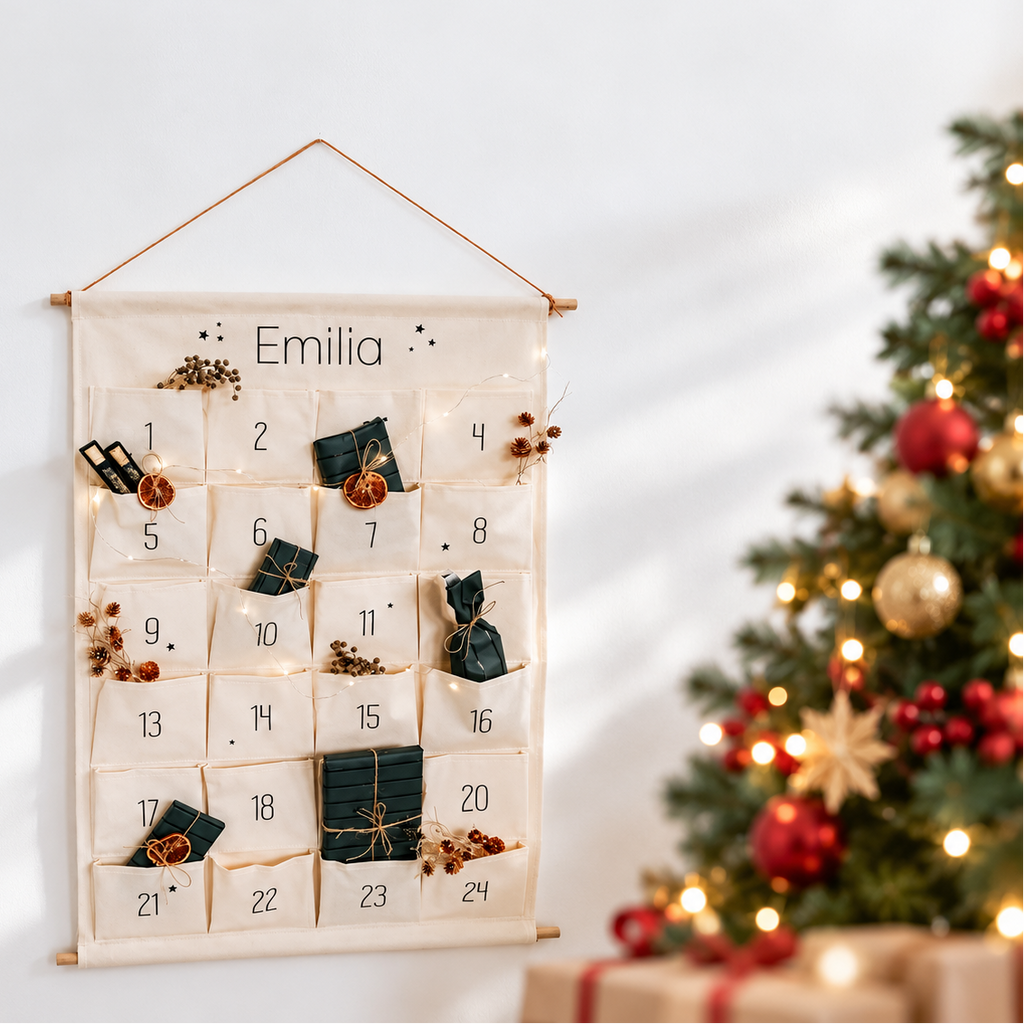 Emilia personalised advent calendar on a bright wall beside a Christmas tree