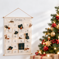 Emilia personalised advent calendar on a bright wall beside a Christmas tree