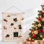 Emilia personalised advent calendar on a bright wall beside a Christmas tree